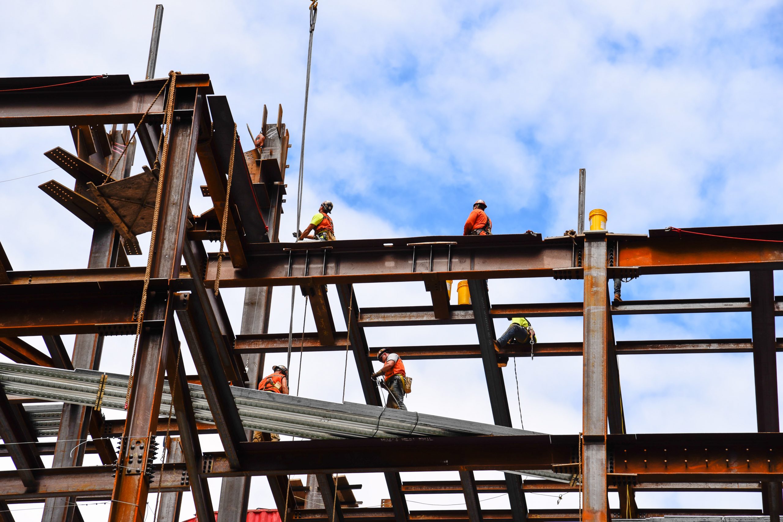 Construction worker working on steel beams